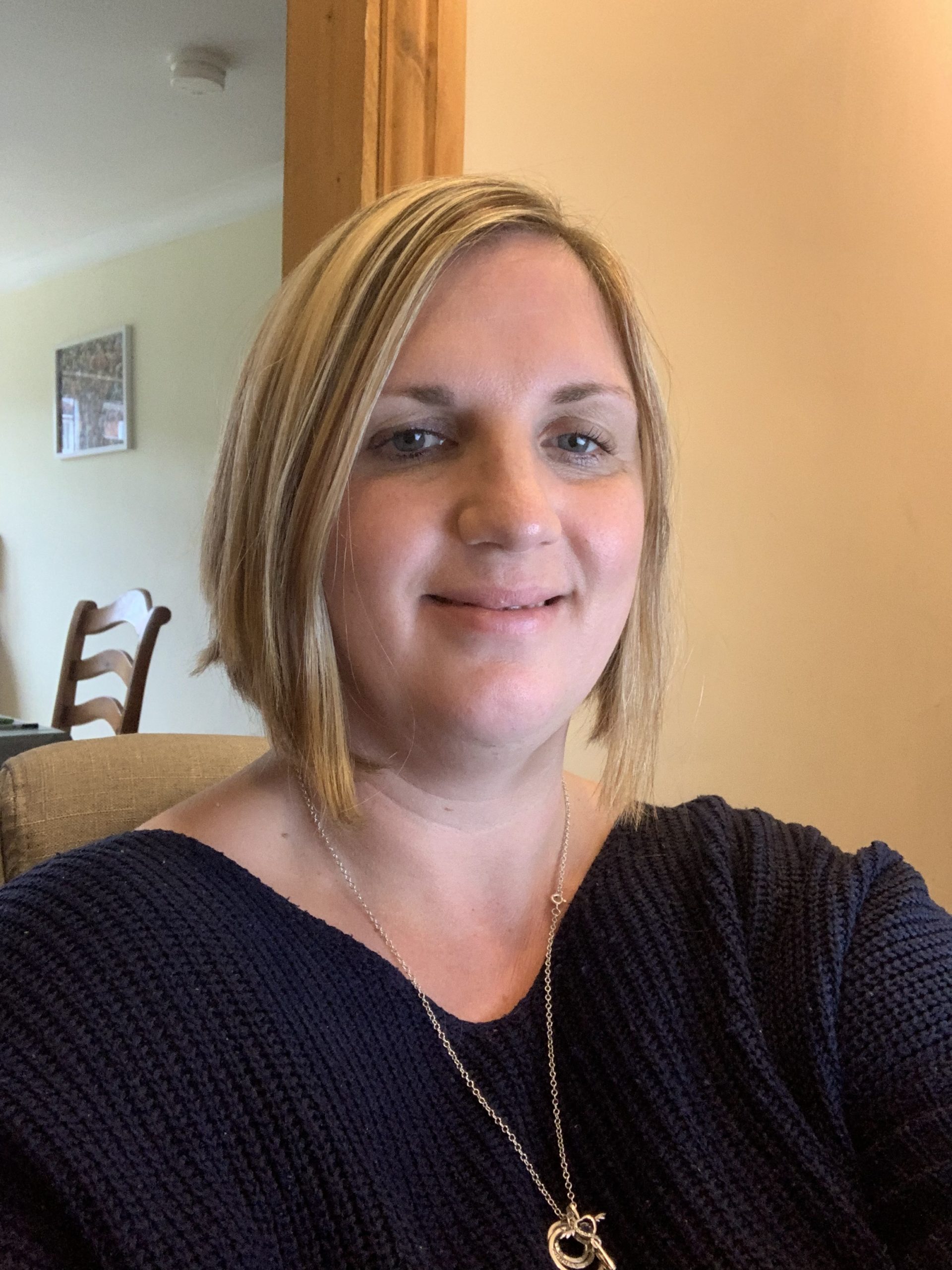Head and shoulders photo of our Deputy CEO, Lisa Martin. Lisa has a big smile on her face, chin-length blonde hair and is wearing a black top.